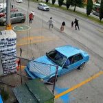Moment shop worker dives into traffic to save child