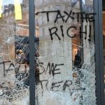 Burnt out cars and shattered glass on Paris streets after protests turn to riots and looting