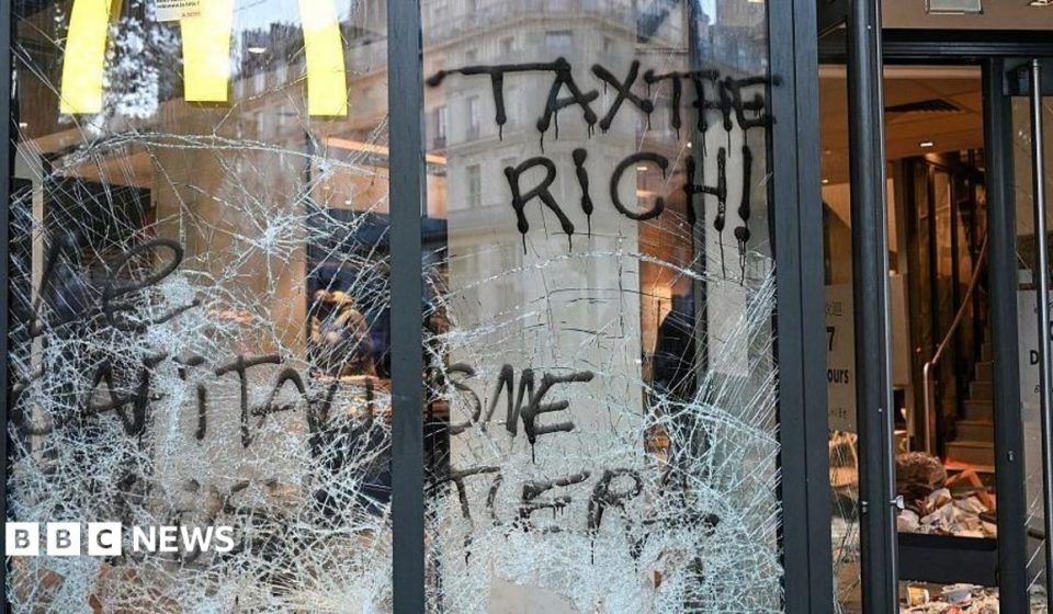 Burnt out cars and shattered glass on Paris streets after protests turn to riots and looting