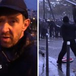 Fireworks and tear gas as protesters and riot police clash in Paris