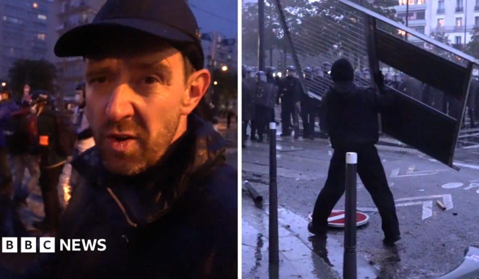 Fireworks and tear gas as protesters and riot police clash in Paris