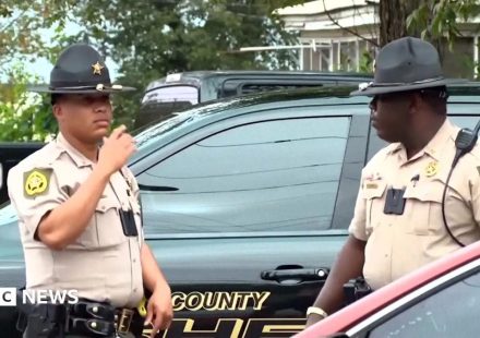 Georgia officials hunt for suspect in shooting that killed two and injured 35