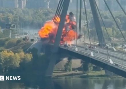 Kyiv bridge hit in further Russian drone attack as German chancellor makes surprise visit
