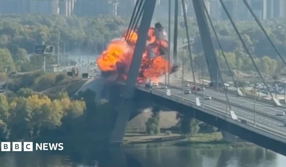 Kyiv bridge hit in further Russian drone attack as German chancellor makes surprise visit