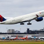 Rising fuel costs slashed Delta’s profit outlook despite strong demand
