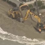 Waves crash into homes as excavators try to protect California properties