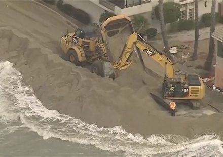 Waves crash into homes as excavators try to protect California properties
