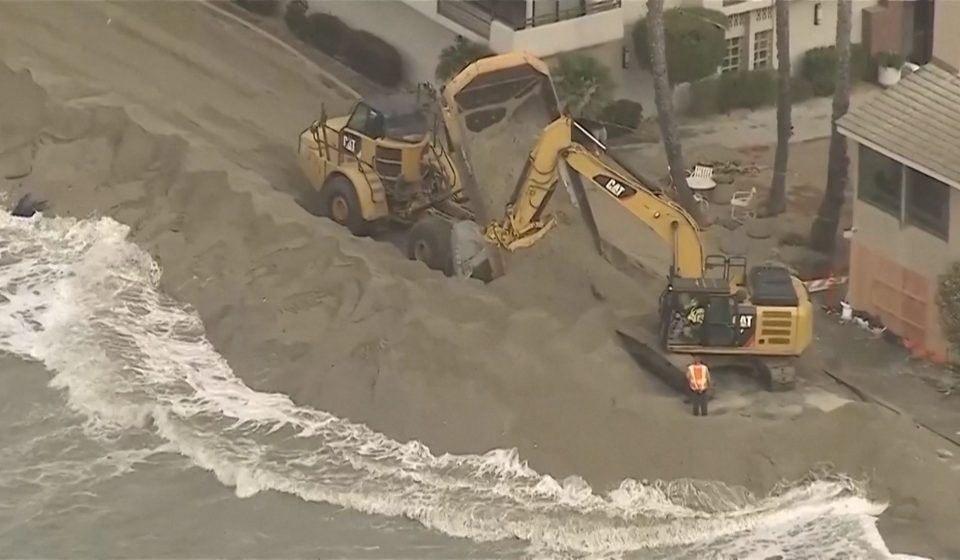 Waves crash into homes as excavators try to protect California properties