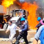Residents douse workers with flaming gasoline during eviction in Peru