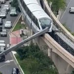 Train slams into crane that collapsed onto railway line in Brazil
